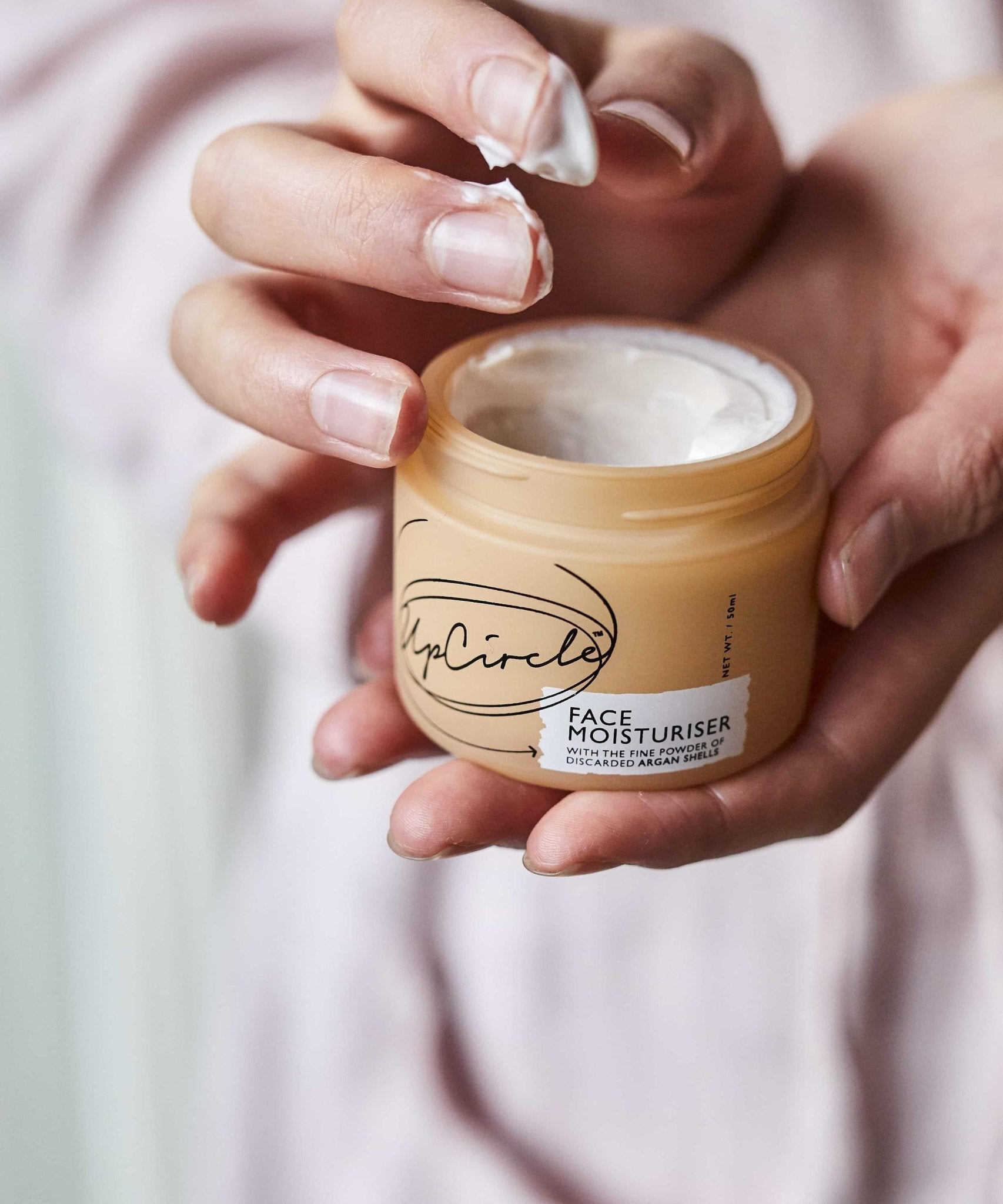 Opened jar of plastic-free UpCircle Face Moisturizer with Argan Powder - Earth Ahead